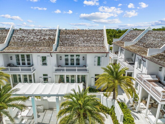 rear view of property with a balcony