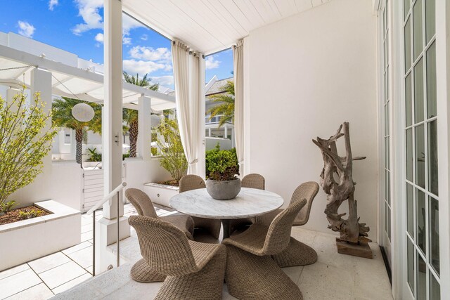 sunroom / solarium featuring wooden ceiling