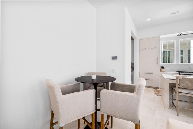 dining space with light tile patterned floors