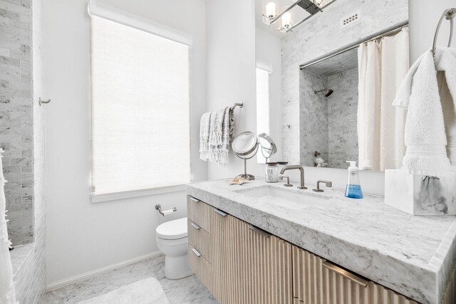 bathroom with vanity, toilet, and a shower with curtain