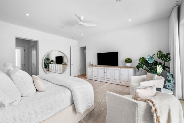 bedroom featuring ceiling fan and light carpet