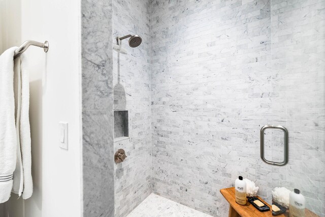 bathroom with a shower with shower door