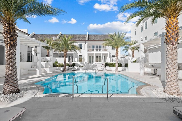 view of swimming pool with a patio area