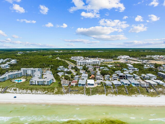 bird's eye view featuring a view of the beach and a water view