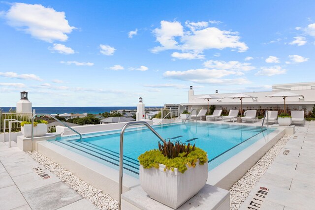 view of pool featuring a water view