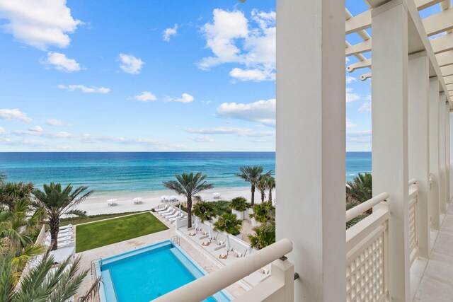 exterior space with a water view and a view of the beach