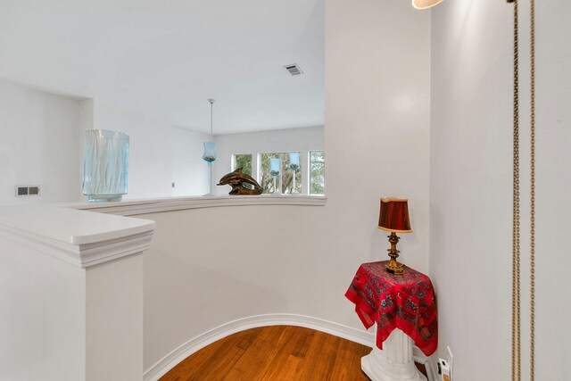 hallway with wood-type flooring