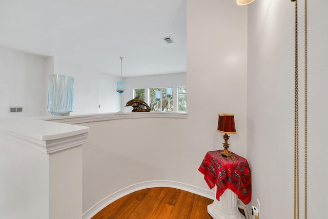 664 Woodland Bayou Dr, Santa Rosa Beach, FL 32459 - hall with visible vents and wood finished floors