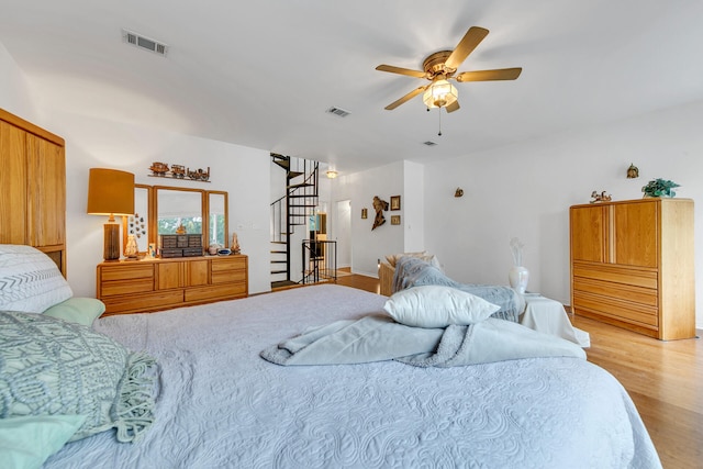664 Woodland Bayou Dr, Santa Rosa Beach, FL 32459 - bedroom featuring light wood finished floors, visible vents, and ceiling fan