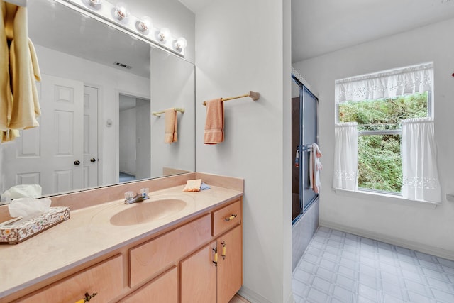 664 Woodland Bayou Dr, Santa Rosa Beach, FL 32459 - bathroom featuring tile patterned floors, enclosed tub / shower combo, visible vents, and vanity