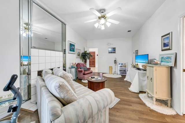 living room with hardwood / wood-style flooring and ceiling fan