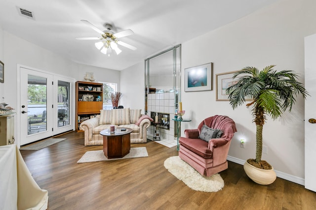 664 Woodland Bayou Dr, Santa Rosa Beach, FL 32459 - living area with a ceiling fan, baseboards, visible vents, and wood finished floors