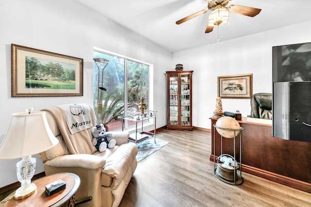 living area with hardwood / wood-style flooring