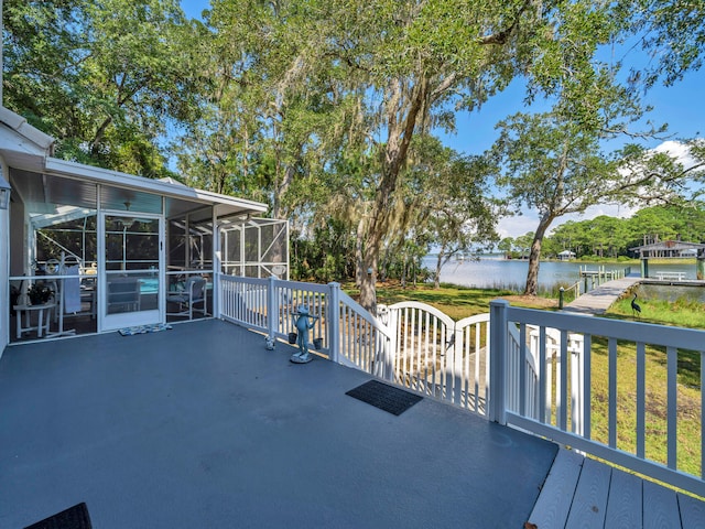 664 Woodland Bayou Dr, Santa Rosa Beach, FL 32459 - wooden deck with a water view and a sunroom