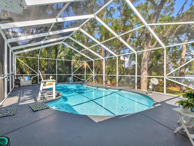 664 Woodland Bayou Dr, Santa Rosa Beach, FL 32459 - outdoor pool featuring a lanai and a patio