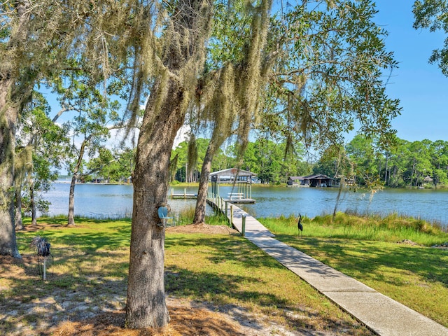 664 Woodland Bayou Dr, Santa Rosa Beach, FL 32459 - view of dock with a water view and a lawn