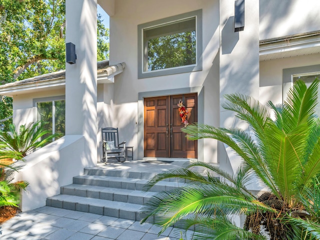 664 Woodland Bayou Dr, Santa Rosa Beach, FL 32459 - view of exterior entry with stucco siding