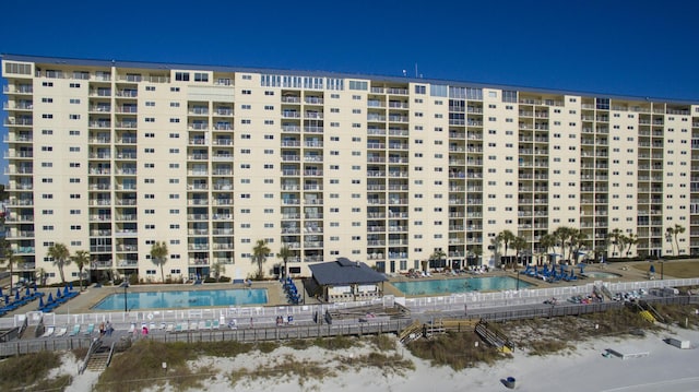 view of apartment building / complex featuring a community pool