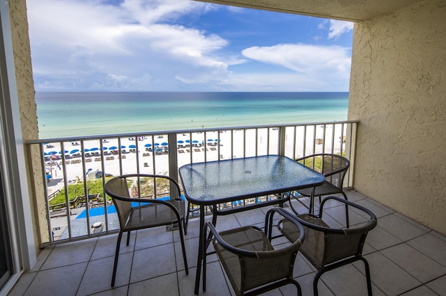 balcony featuring view of water and beach
