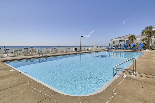 community pool featuring a patio area