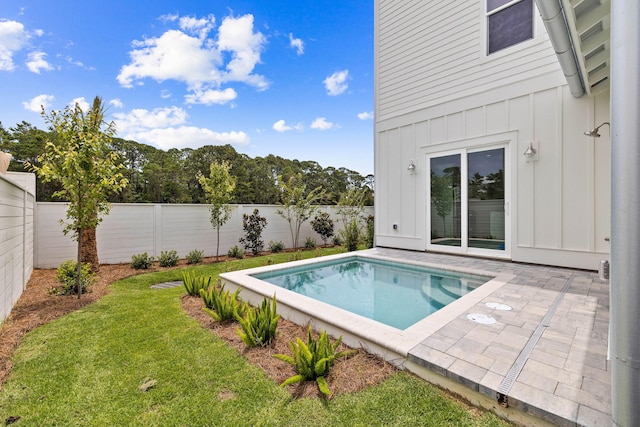 view of swimming pool with a fenced in pool, a fenced backyard, a yard, and a patio