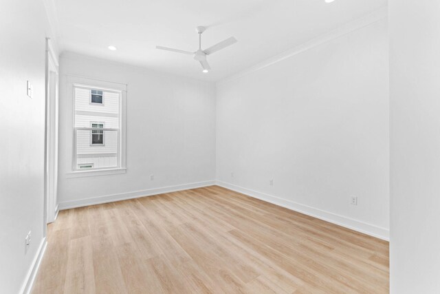 unfurnished room featuring crown molding, light hardwood / wood-style flooring, and ceiling fan