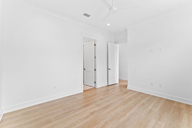 unfurnished room with ceiling fan, light hardwood / wood-style floors, and ornamental molding