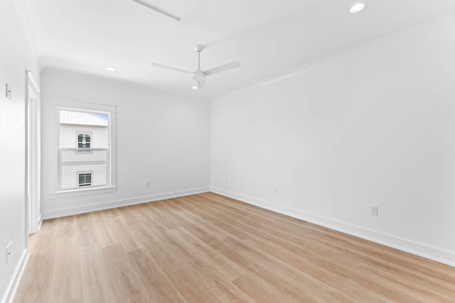 unfurnished room with ceiling fan, crown molding, and light hardwood / wood-style flooring