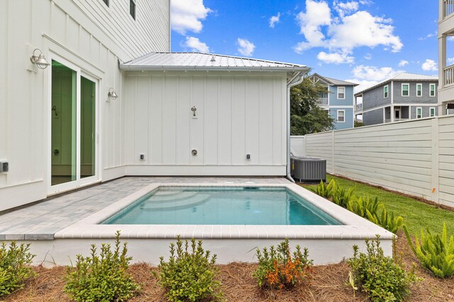 view of swimming pool featuring central AC