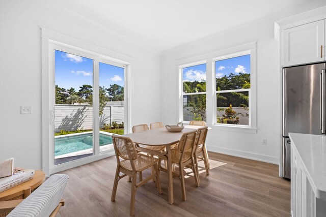 dining area with light hardwood / wood-style flooring