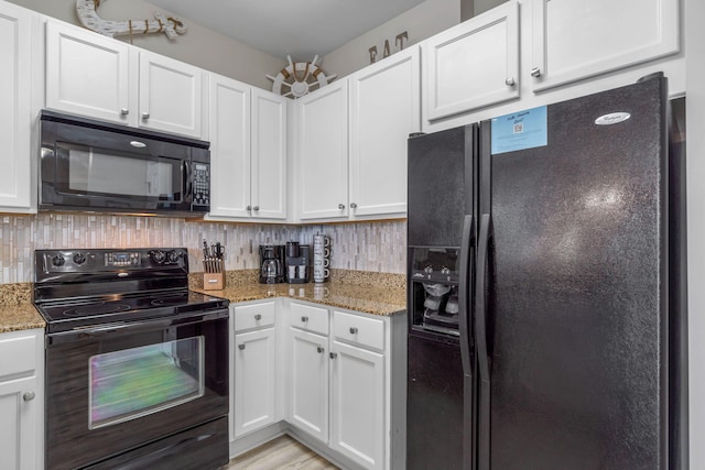 kitchen with black appliances, decorative backsplash, and white cabinets