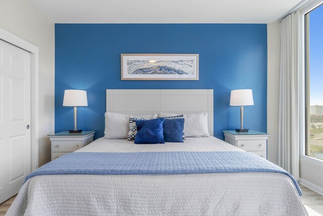 bedroom featuring a closet and light hardwood / wood-style floors