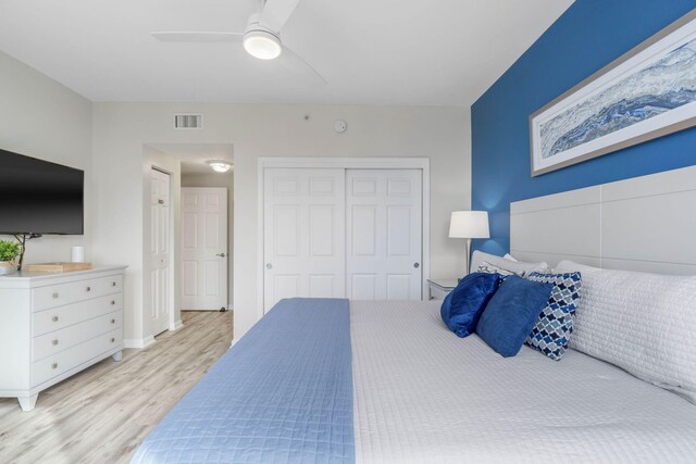 bedroom featuring a closet, ceiling fan, and light hardwood / wood-style floors