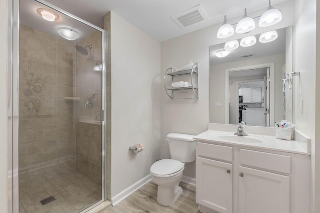 bathroom with a shower with shower door, wood-type flooring, toilet, and vanity