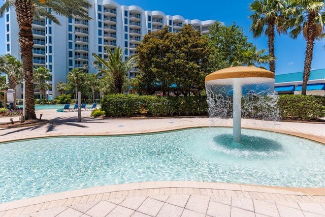 view of pool with pool water feature