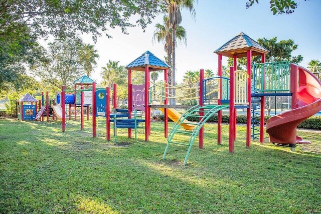 view of jungle gym featuring a lawn