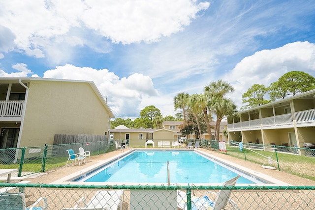 view of swimming pool featuring a patio area