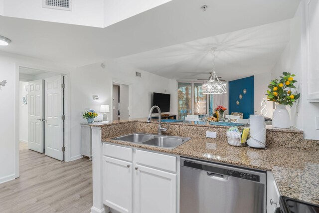 kitchen with light wood-type flooring, white cabinets, stainless steel appliances, and sink