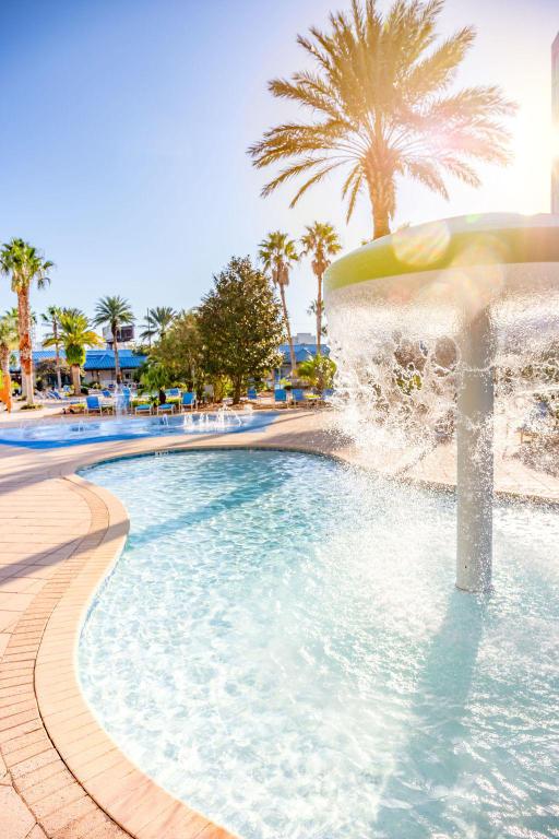 view of pool with pool water feature