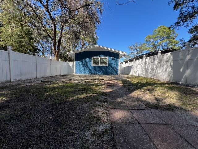 exterior space with a fenced backyard