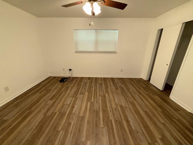4 3rd Ave, Shalimar, FL 32579 - unfurnished bedroom with dark wood finished floors, baseboards, and a ceiling fan