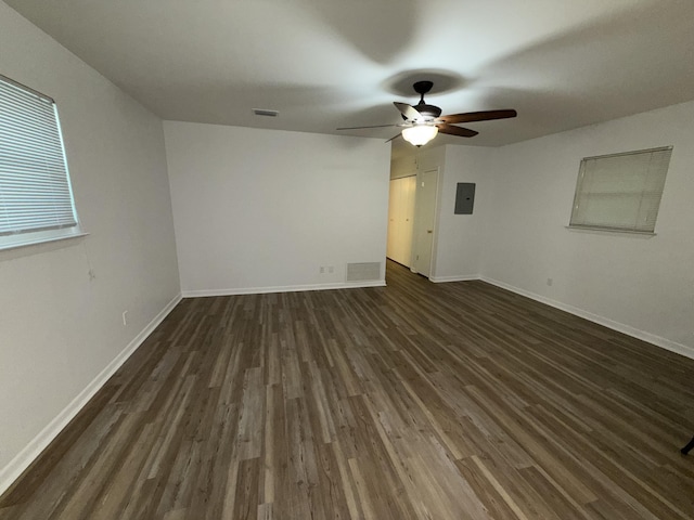 4 3rd Ave, Shalimar, FL 32579 - spare room with baseboards, dark wood-style flooring, visible vents, and ceiling fan