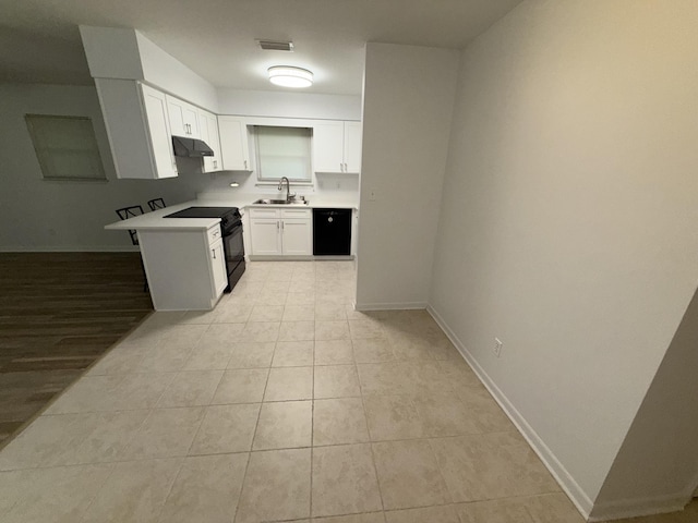 4 3rd Ave, Shalimar, FL 32579 - kitchen featuring under cabinet range hood, a sink, white cabinetry, black appliances, and light countertops