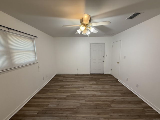 4 3rd Ave, Shalimar, FL 32579 - empty room with baseboards, dark wood-style flooring, visible vents, and ceiling fan