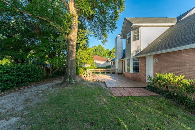 view of yard featuring a patio and fence