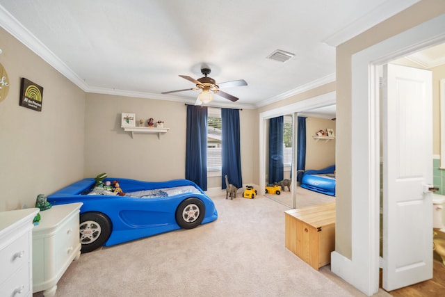 bedroom with crown molding, light carpet, and ceiling fan