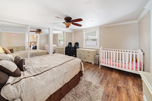 bedroom featuring crown molding, ceiling fan, and dark hardwood / wood-style flooring