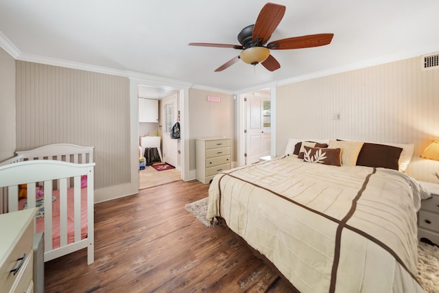 bedroom with ceiling fan, dark hardwood / wood-style flooring, and crown molding