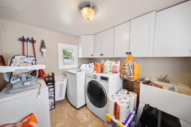 laundry room featuring separate washer and dryer, light tile patterned floors, cabinets, and sink