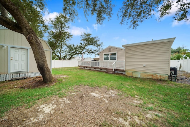 view of yard with a wooden deck